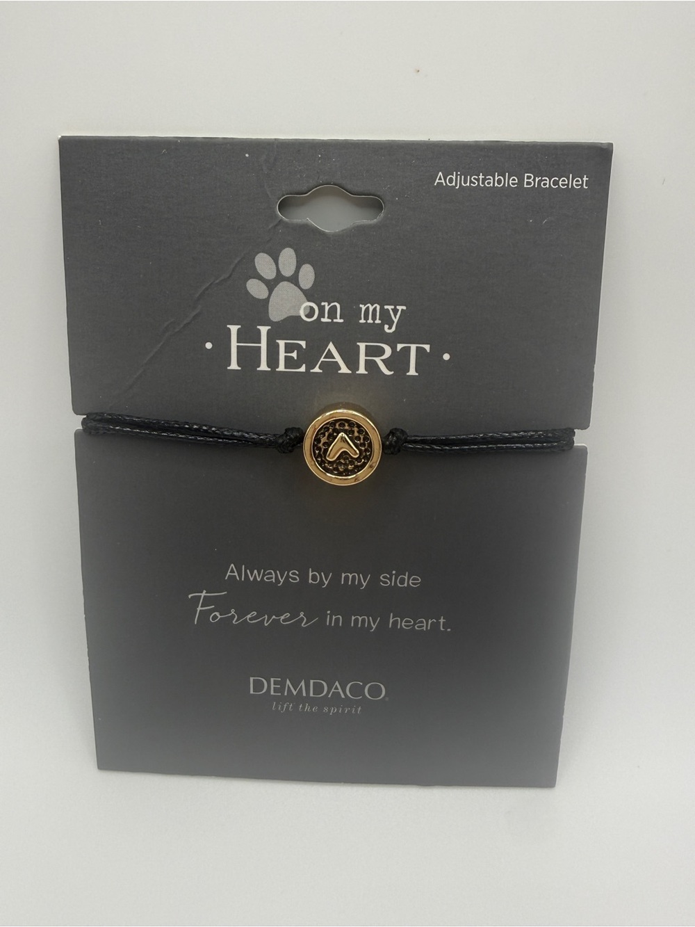Demdaco Black Cord Bracelet with Gold Paw Accent
